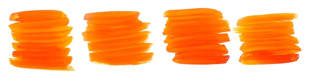 Free vector orange watercolor paint brush strokes set of four