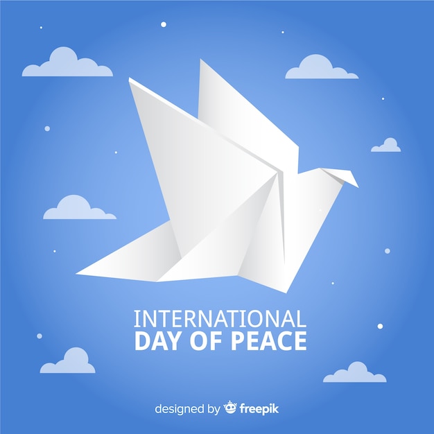 Origami peace day with dove and clouds