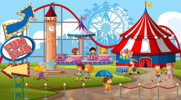 An outdoor funfair scene with many children