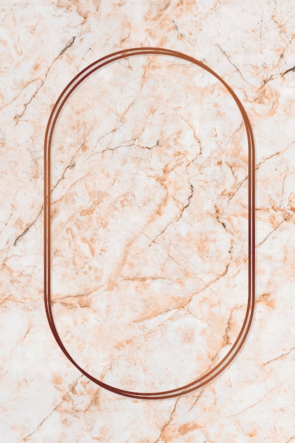 Oval bronze frame on orange marble background 