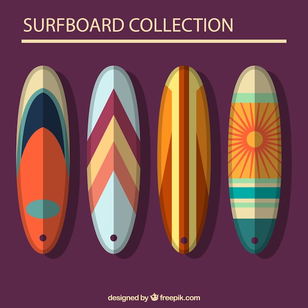 Pack of four flat surfboards with abstract design