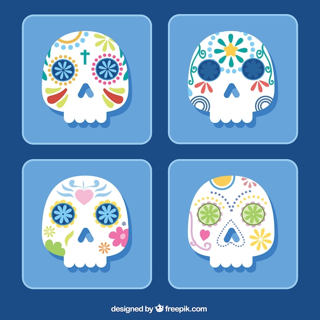 Free vector pack of four mexican skulls