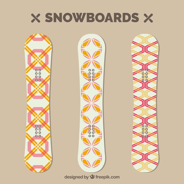 Pack of three snowboards with geometric designs