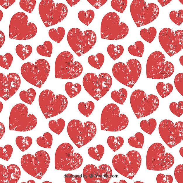 Free vector pattern with stamped hearts