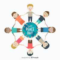 Free vector peace day composition with children holding hands around the world