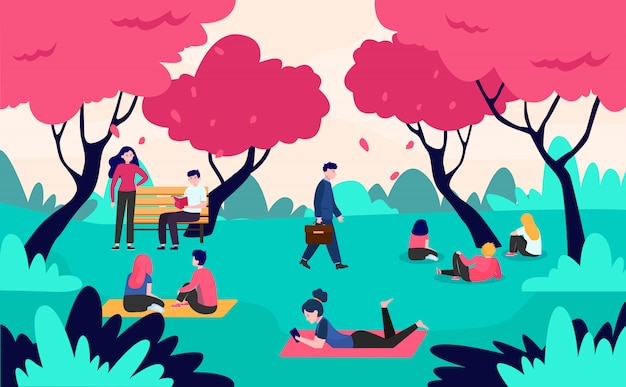 People relaxing in park with blooming pink cherry trees