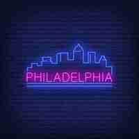 Free vector philadelphia neon lettering and city buildings silhouette. sightseeing, tourism, travel.