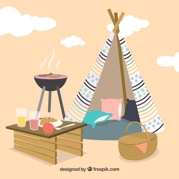 Picnic e barbecue con uno sfondo tepee