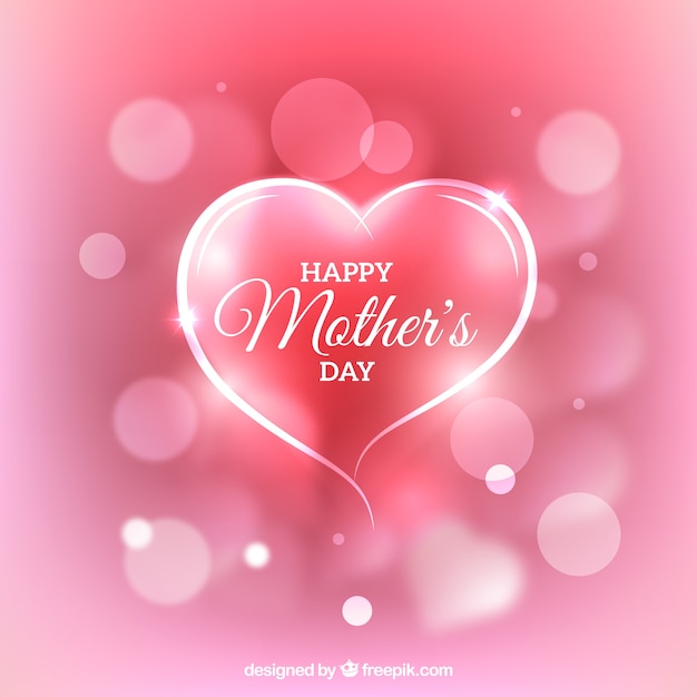 Pink background with decorative heart and blurred effect for mother's day