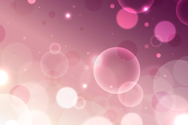 Free vector pink gradient with bokeh effect wallpaper