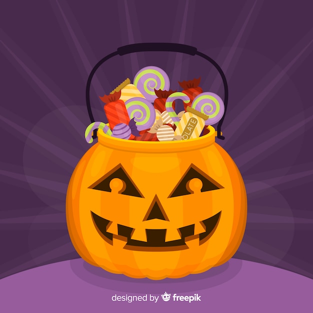 Free vector pumpkin bag filled with candies for halloween