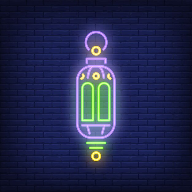 Ramadan lantern neon sign. Ornate traditional lamp on dark brick wall background.