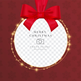 Realistic christmas photo frame with red ribbon
