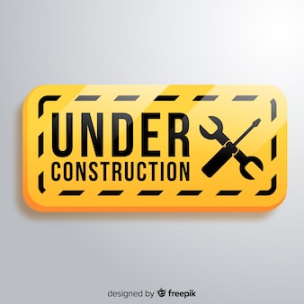 Realistic under construction sign background Free Vector