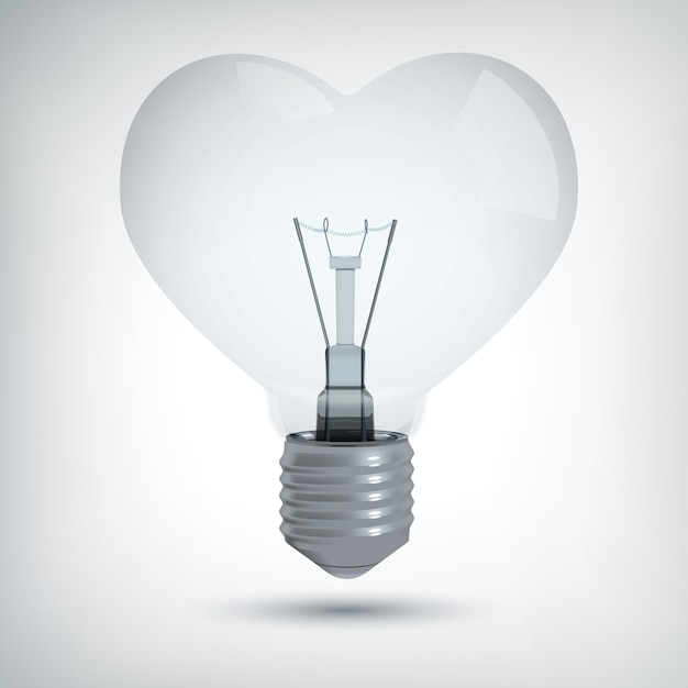 Реалистичная концепция дизайна лампочки в форме сердца на сером изолированном