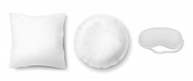 realistic set with blindfold and two clean white pillows, square and round
