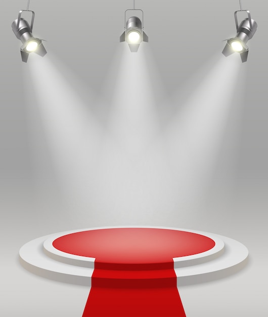 Free vector realistic stage with spotlights red carpet in the middle of the room vector illustration