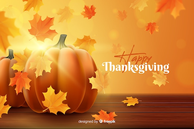 Free vector realistic thanksgiving background with dried leaves