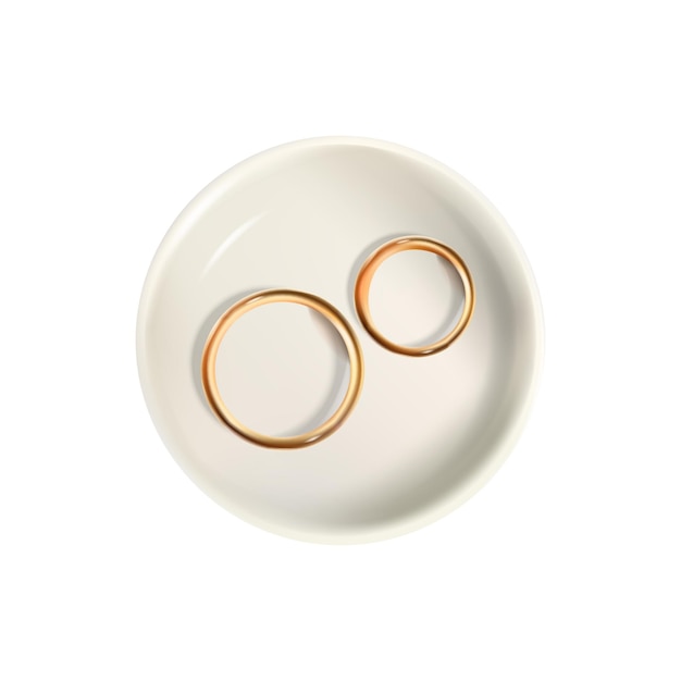 Realistic wedding rings on plate