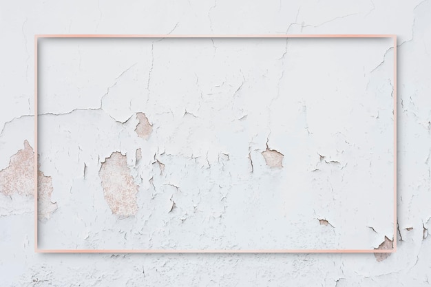 Free vector rectangle rose gold frame on weathered paint wall background vector