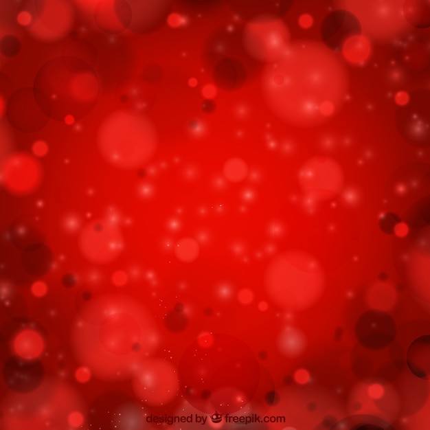 Free vector red background with bokeh effect