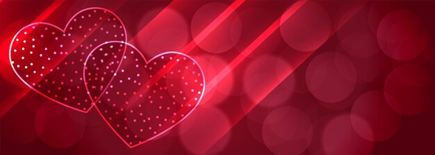 Romantic two shiny hearts bokeh banner background