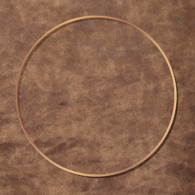 Free vector round gold frame on brown leather background vector