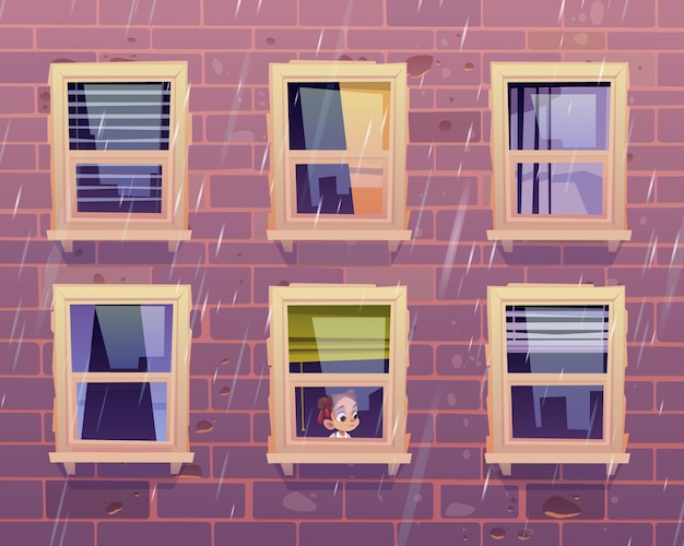 Грустная девушка смотрит через окно на дождь за пределами фасада здания с кирпичной стеной
