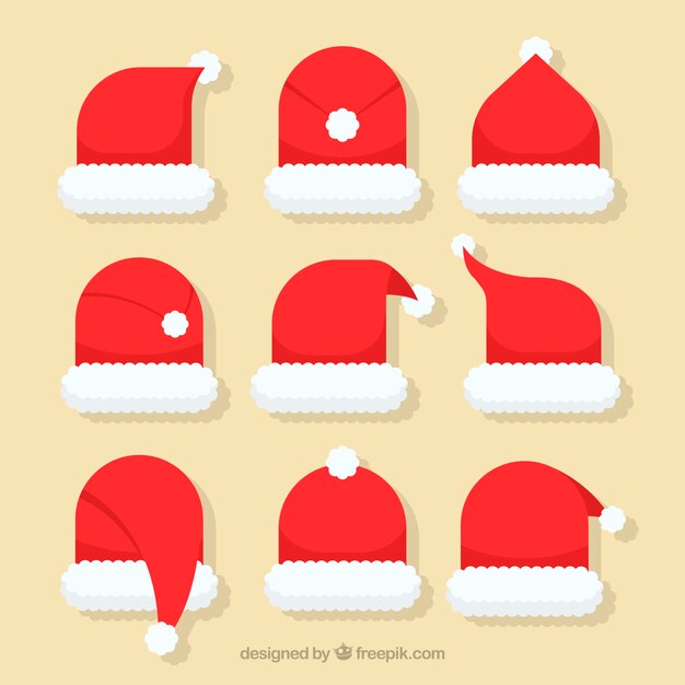 Vettore gratuito collezione di cappelli di babbo natale in design piatto