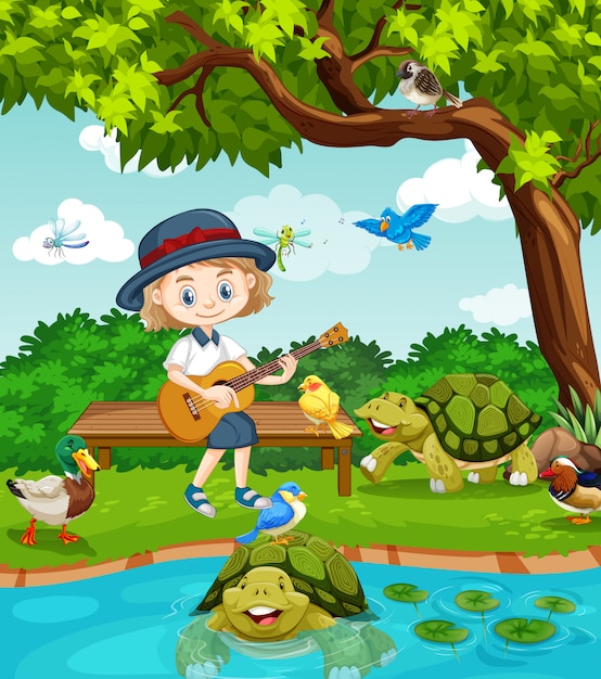 Scena con ragazza carina, suonare la chitarra nel parco con molti animali