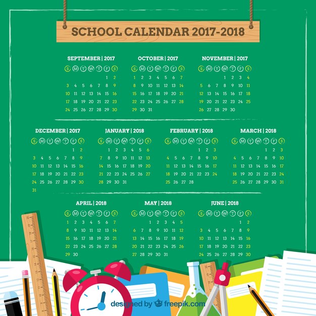 School materials and calendar on the blackboard