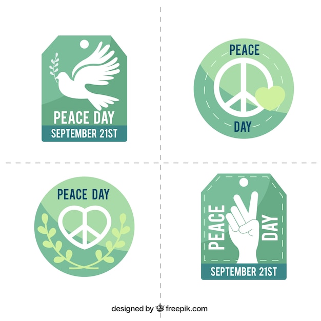 Free vector selection of badges in green tones for the international day of peace