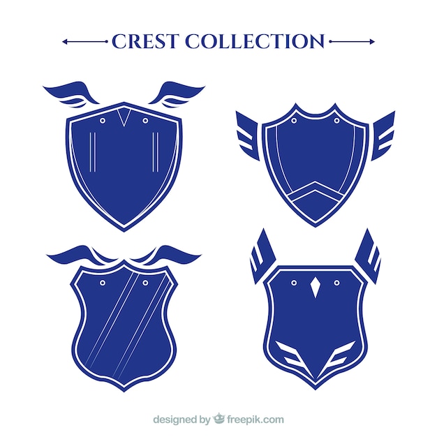 Set of blue heraldic shields with wings