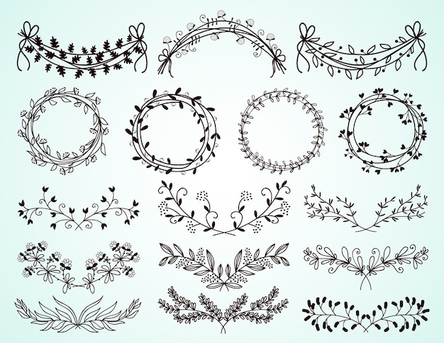 Set of dainty black and white hand-drawn floral and foliate borders and wreaths for decorative design elements on greeting cards