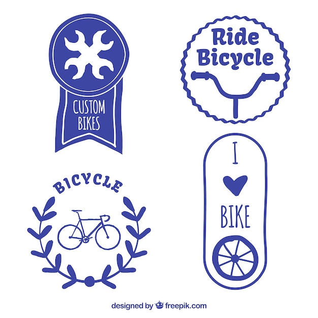 Set of decorative hand painted blue bike badges