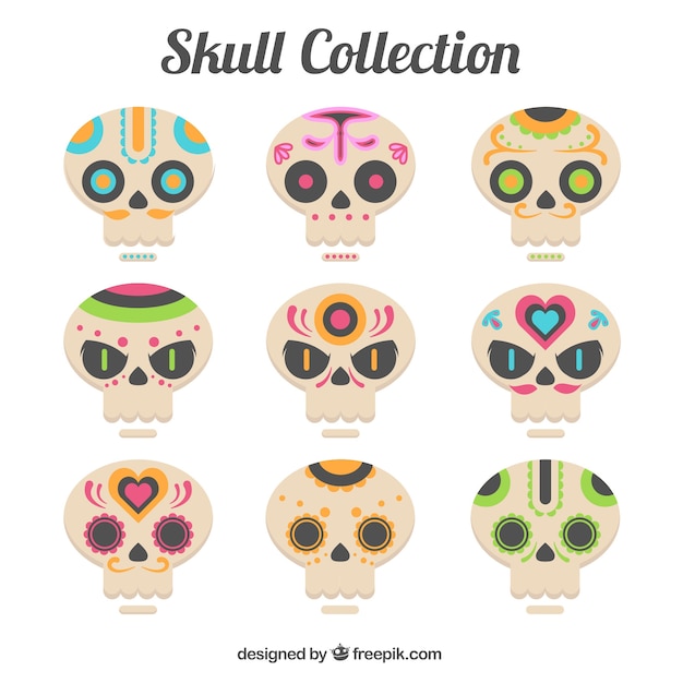 Free vector set of decorative skulls in flat design