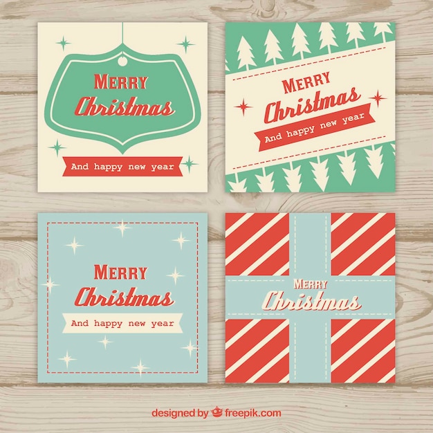 Free vector set of four christmas cards in vintage design