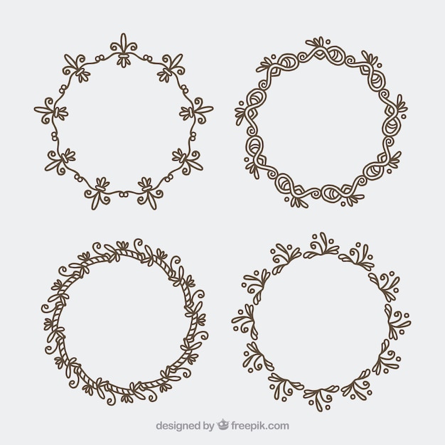 Free vector set of four hand-drawn floral wreaths