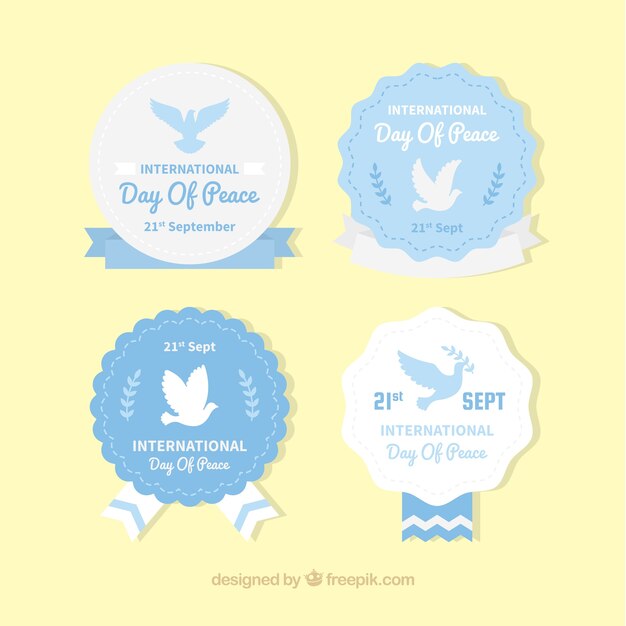 Free vector set of four peace day logos in vintage style