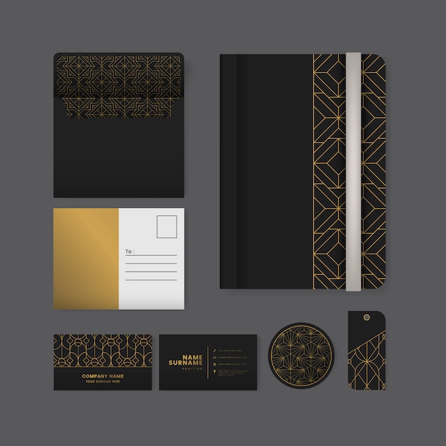 Set of golden geometric pattern on black surface stationery