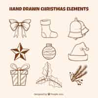 Vettore gratuito set di elementi d'annata natalizia disegnati a mano