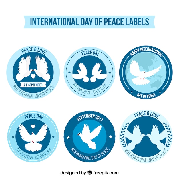 Free vector set of labels with doves for day of peace