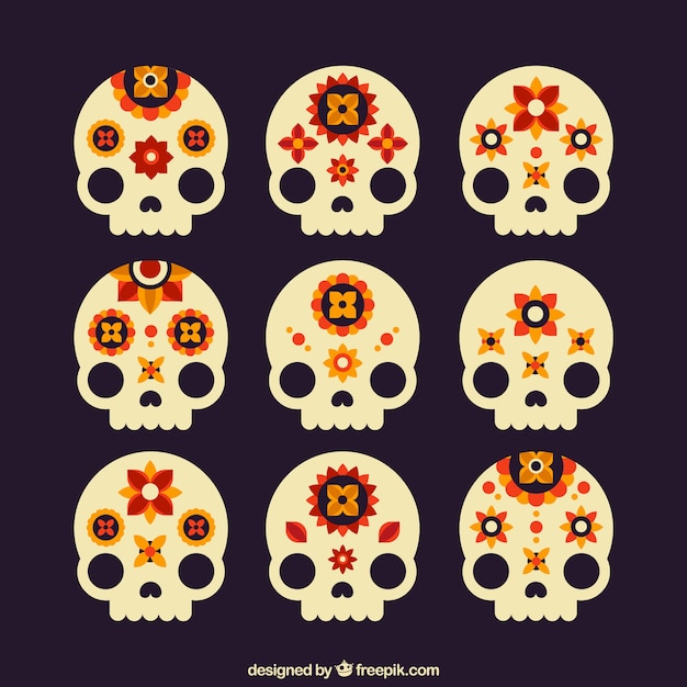 Free vector set of nine skulls with floral decoration