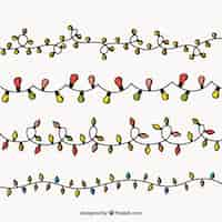 Бесплатное векторное изображение Набор ручных рождественских огней