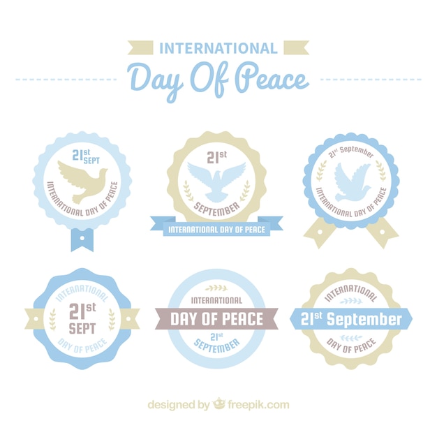 無料ベクター レトロなデザインの平和の日のロゴのセット