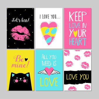 ピンク、黄色、青、黒、白の色のバレンタインデーカードのセットにキス、ハート、猫。レタリングのチラシテンプレート。タイポグラフィのポスターやカード、ラベル、バナーデザインコレクション。