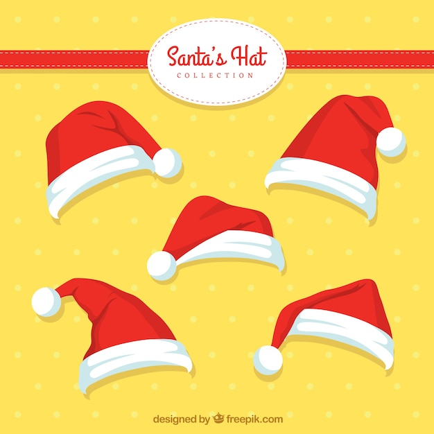 Free vector several hand-drawn santa claus caps