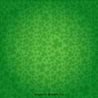 Free vector shamrocks background in green color