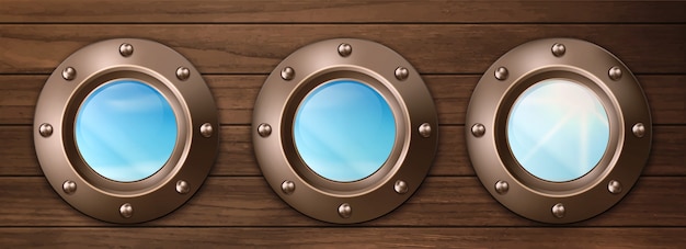 Ship portholes on wooden wall with sky view