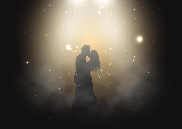 Silhouette of a bride and groom dancing under spotlights in smoky atmosphere